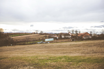 Fototapeta na wymiar Rural house and farm, countryside landscape