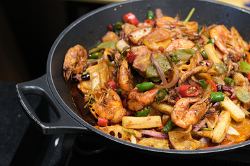 close up dry pot shrimp with vegetables. Chinese cuisine. black background