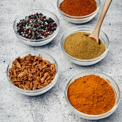 Spices and spices in glass saucers. Cooking and kitchen.