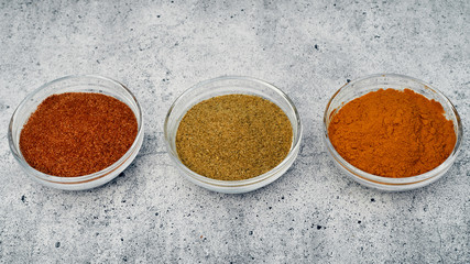 Spices and spices in glass saucers. Cooking and kitchen.