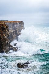 Big waves over the cliff on december, Sagres, Portugal, European coast.