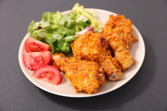 Fried Crispy Chicken Leg With Salad And Tomato