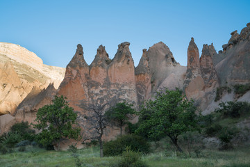 Cappadocia fairy chimneys and carved rock houses. Kapadokya is known as one of the best places to fly with hot air balloons worldwide. Goreme, Cappadocia, Turkey.