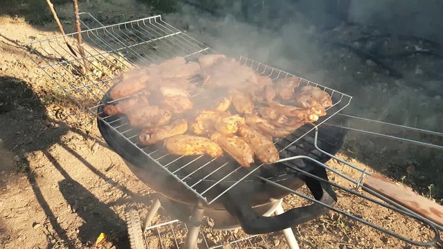 Barbecue with delicious grilled chicken meat on grill
