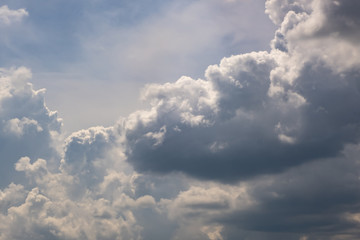 Blue sky background with big white tiny stratus cirrus striped clouds