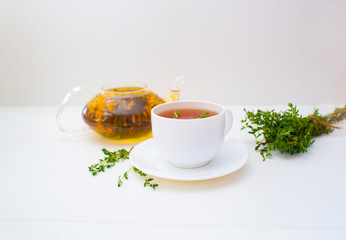 herbal tea with thyme on the white background