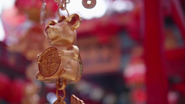 The mobile of the rat year. The Chinese symbol of lucky life or the feng shui symbol in the Chinese shrine or Chinese temple. The meaning of the words are the rich or good luck in money and happiness.