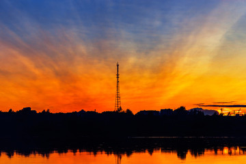 river and tower at sunset on a summer evening
