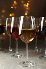 Glasses of wine against background with blurred lights