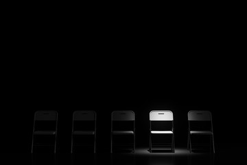 Dark room with chairs with a single isolated chair illuminated by a spotlight. Concept of choice and uniqueness. 3d rendering