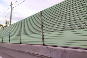 Fototapeta na wymiar metal fence protecting the road close up