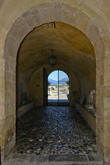 Obraz premium A narrow street among the old houses of Scalea, a rural village in the Calabria region.