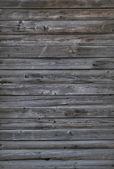 Gray old planks for background. The vertical location. Weathered Barn Boards