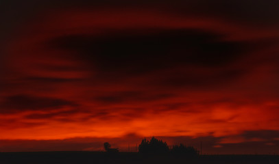 Dramatic red lights in the sky during sunset