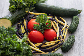 
Fruits and vegetables laid out on the background. Gray background and there lie the harvest of summer and autumn.