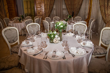 
Round banquet table setting in classic style using floristry.