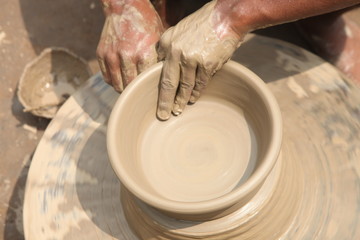 clay potter, clay molding, man plotter