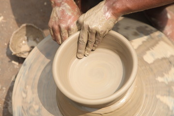 clay potter, clay molding, man plotter