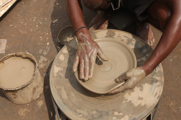 clay potter, clay molding, man plotter