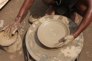 clay potter, clay molding, man plotter
