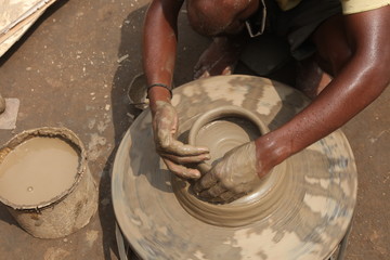 clay potter, clay molding, man plotter