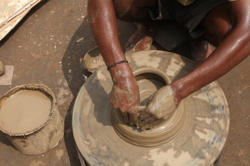 clay potter, clay molding, man plotter