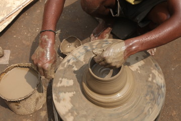 clay potter, clay molding, man plotter