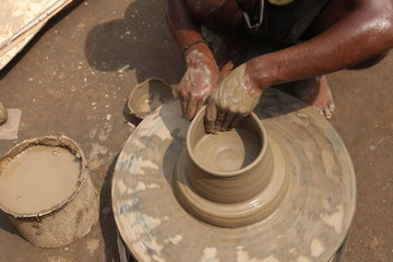 clay potter, clay molding, man plotter