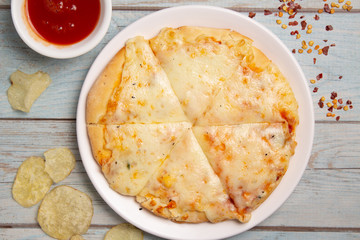 Cheese Pizza mozzarella cheese, basil, and tomato, template for your design and menu of a restaurant, on isolated wooden background