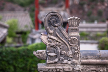 Part of traditional oriental tile roof, dragon form shape ending
