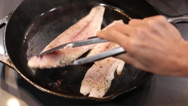 Fry Cooking Red Fish White Meat on Cast Iron skillet video