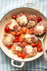 Pork tenderloins with parma ham, mozzarella and tomatoes