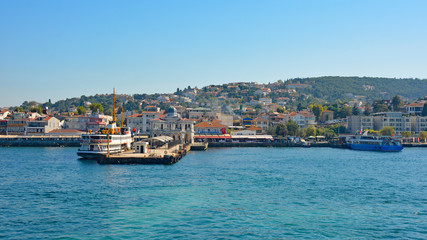 Fototapeta premium A ferry docked at the ferry station on Buyukada, one of the Princes' Islands, also known as Adalar, in the Sea of Marmara off the coast of Istanbul, Turkey