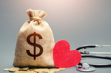 Dollar money bag and stethoscope. Health life insurance and financing concept. Funding healthcare...