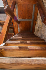 Fototapeta na wymiar old wooden staircase in the house