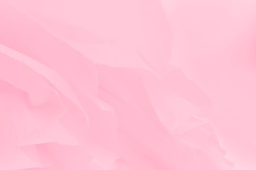 Fototapeta na wymiar Soft light pink flowing fabric, beautiful pink color background