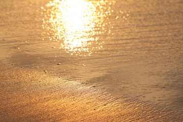 Plakat Wet golden sand on the sunset, abstract texture