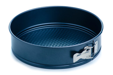 Round metal baking dish on white background isolation