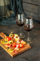 glass of wine and a snack canapes cheese plate serving size natural product portion top view place for text copy space