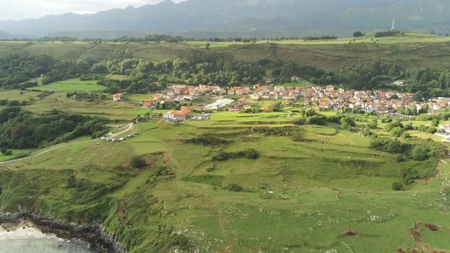 Asturias. Coastal landscape in village of Cue, beach of Llanes. Spain. Aerial Drone Footage