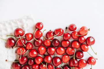 Fresh ripe cherry on the white wooden background. Top view. Copy, empty space for text