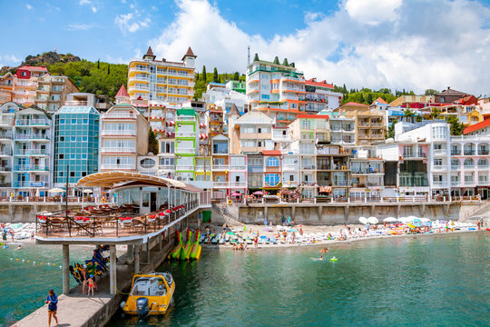 Embankment in the Utes city, Crimea. Colorful houses are close to each other, beautiful scenery