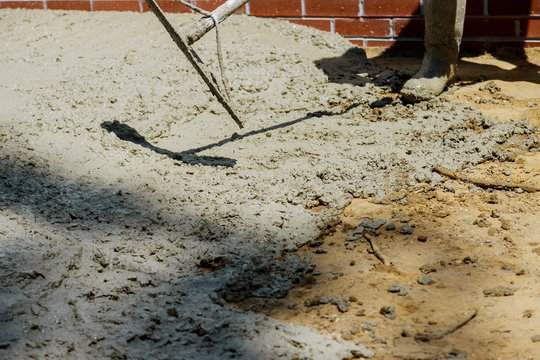 Construction process making of freshly poured cement sidewalk