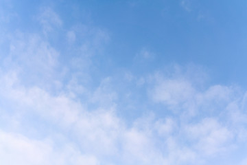 Fototapeta premium White cumulus clouds against the background against blue on a blue background.