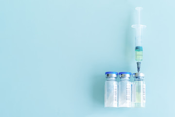 medical syringe and vials with vaccine, medicine