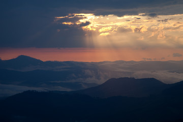 Fototapeta na wymiar Misty sunrise in the mountains