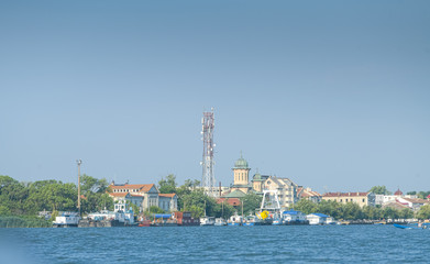Fototapeta premium Sulina city in Danube Delta view from the river during a sunny morning