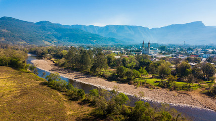 Mampituba river, city of Praia Grande SC and mountains in the background