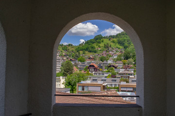 view through arched windows of the city of Thun in Switzerland