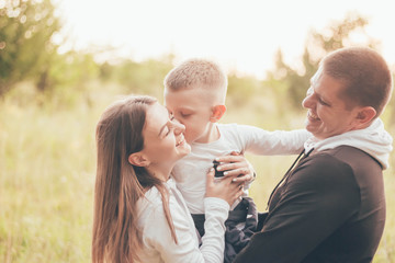 
Family in tracksuits hugging and laughing